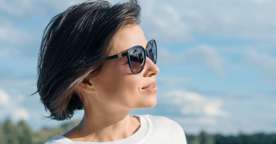 Naples Florida, mature woman outdoors, minimally invasive approach to reducing double chin with Kybella